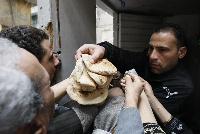 Egyptians gather to buy bread in Central Cairo in January 31, 2011, during anti-government protests.